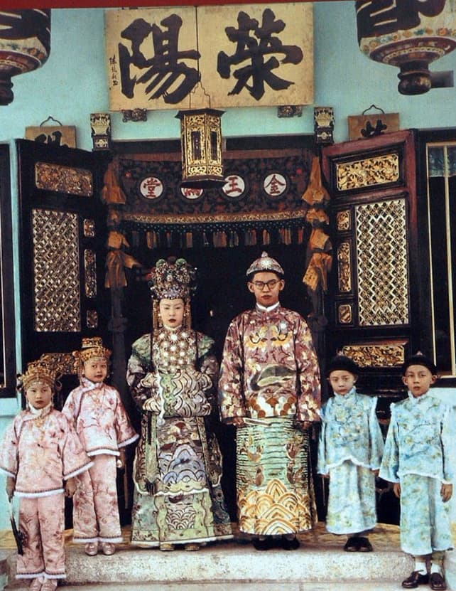 Historical wedding portrait of a Peranakan (Baba-Nyonya) couple in full traditional attire